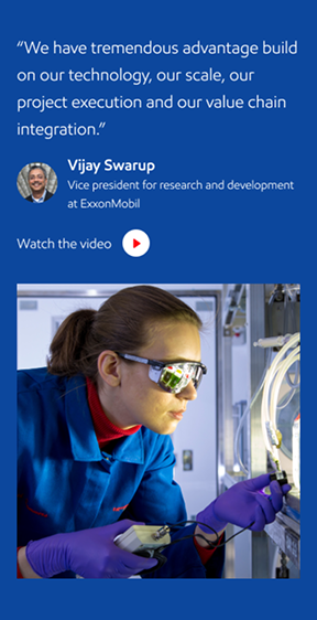 Photo of a man in a room using a tablet computer